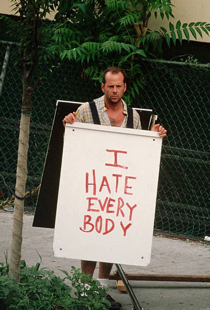 Bruce Willis Holding a Sandwich Board Pictures | Getty Images