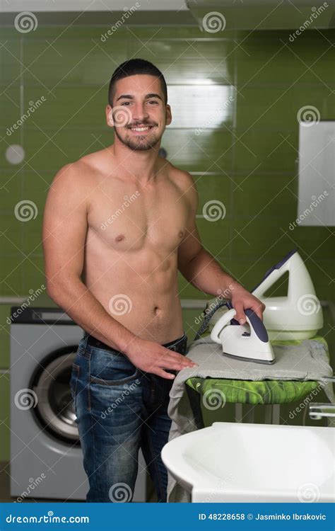 Naked Man Ironing Clothes in a Utility Room Stock Photo - Image of