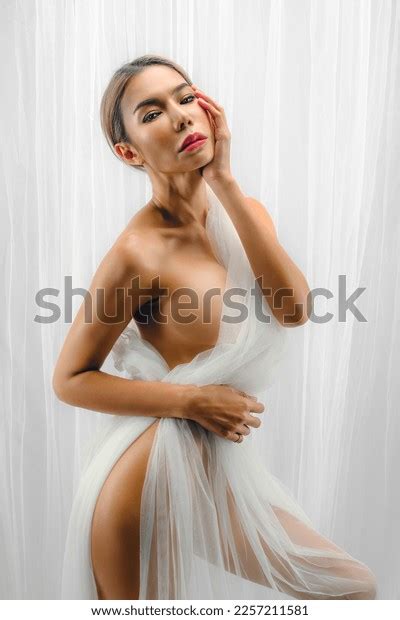 studio artistic nude portrait asian woman stock photo