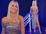 Tess Daly puts on a leggy display in shimmering silver midi dress a...