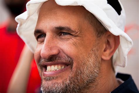 Happy Football Fan Smiling While Cheering For Favorite Team In Crowded ...