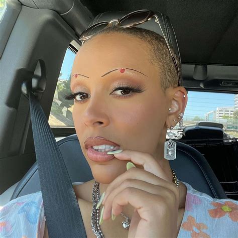 Doja Cat slams critics of her shaved head: 'Go f—k yourselves'