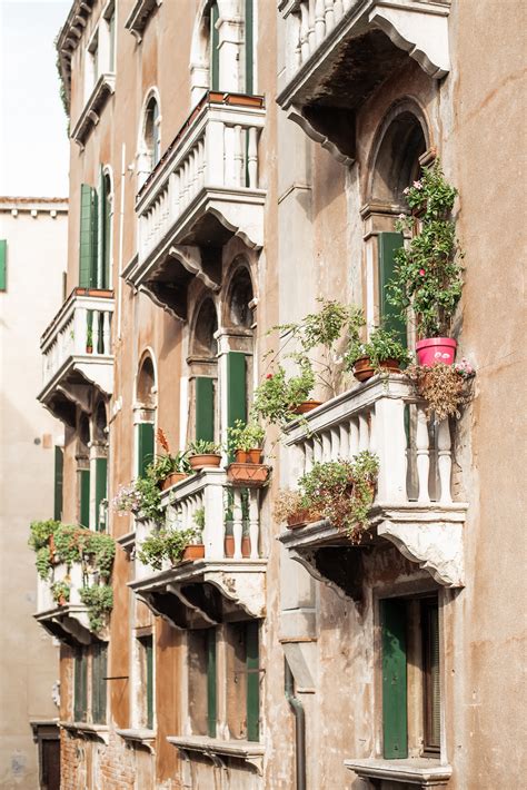 Historical old building with small balconiesFree Stock Photo