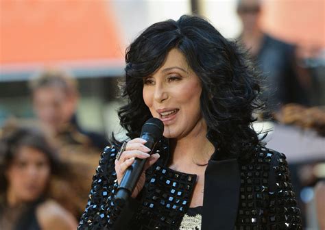 Download Legendary Singer Cher Performing on Stage with Microphone ...