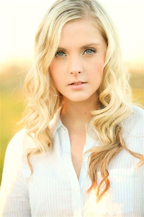 Download A Young Woman With Long Blonde Hair | Wallpapers.com