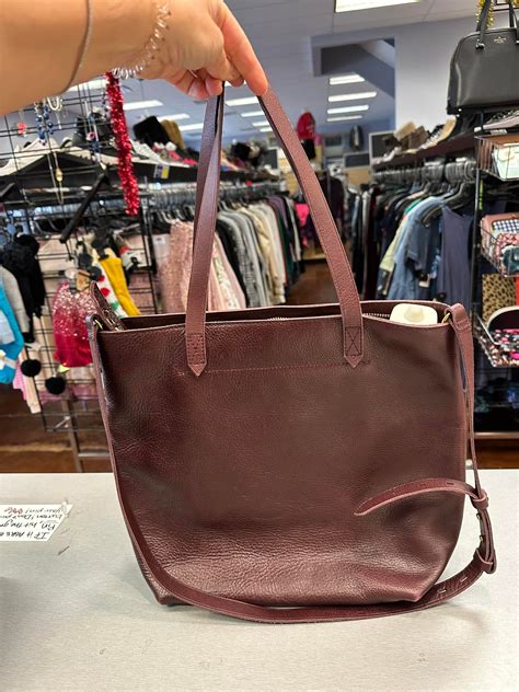This full size leather tote from... - NTY Clothing Exchange