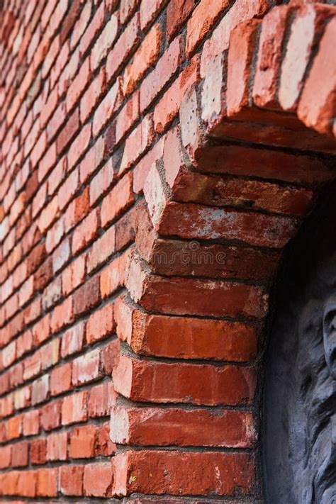 slanted view  red brick wall  protruding archway  partial