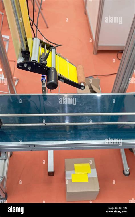 automated labeler machine  packing  conveyor factory stock photo