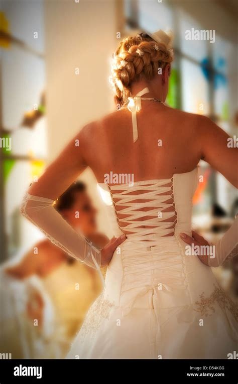 A young woman wearing her wedding dress Stock Photo - Alamy