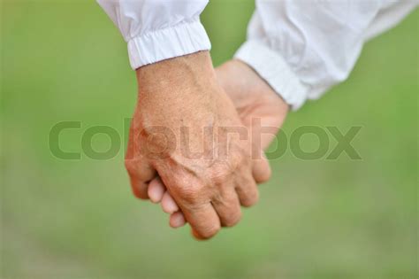 Hands held together | Stock image | Colourbox