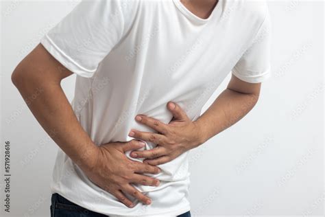man  abdominal pain  white background stock photo adobe stock
