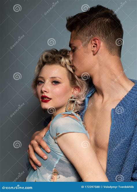 Young Happy Couple Posing in Studio. Passion and Sensual Touch. I Love