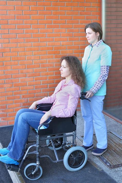 nurse  patient  wheelchair  front  main stock photo image