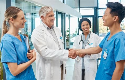 premium photo healthcare doctor  nurse shaking hands   hospital