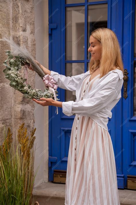 Free Photo | Lifestyle of person decorating their front door