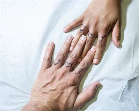 premium photo hands   fresh tattoo