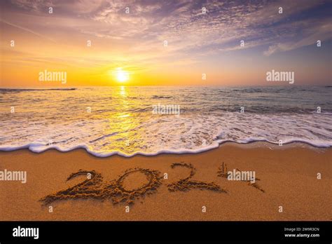 Happy New Year 2024 concept, lettering on the beach. Written text on ...