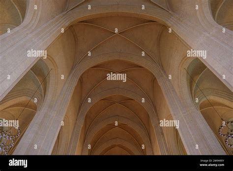 Detail of cream brick vault, arch, rib wall, column and clerestory ...