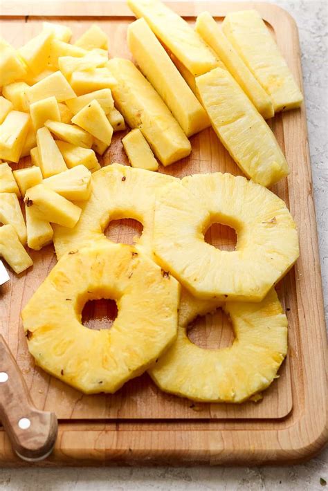 cut pineapple  wooden skillet