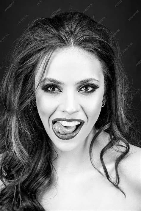 Premium Photo | Sensual woman open mouth tongue touches the teeth