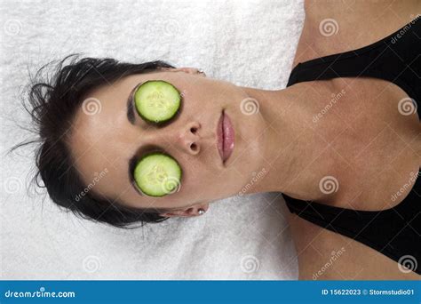 Woman With Cucumber Slices On Her Eyes Stock Photos - Image: 15622023