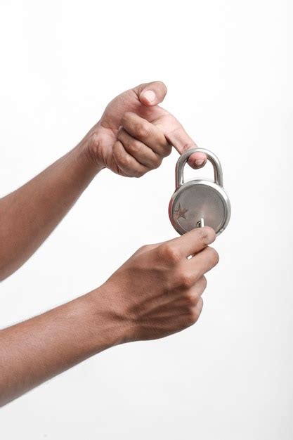 Premium Photo | Round lock and key holding in hand.