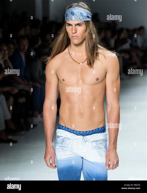 NEW YORK, NY - JULY 16, 2015: Travis Smith walks the runway during the ...