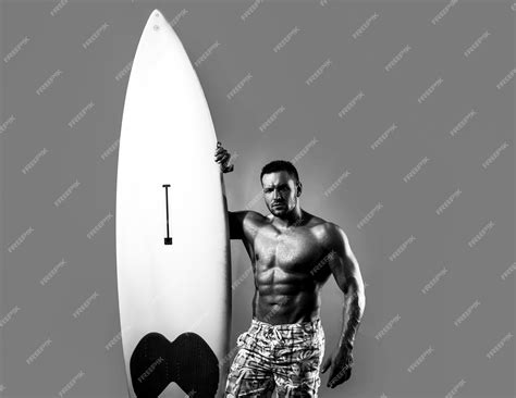 Premium Photo | Serfer muscular man with neon surfboard isolated on
