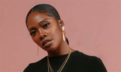 essential tiwa savage songs   time notjustok
