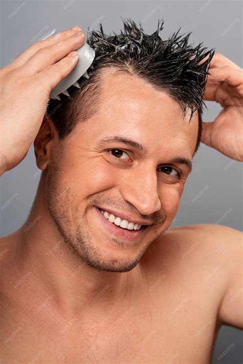 Free Photo | Medium shot man giving himself scalp massage