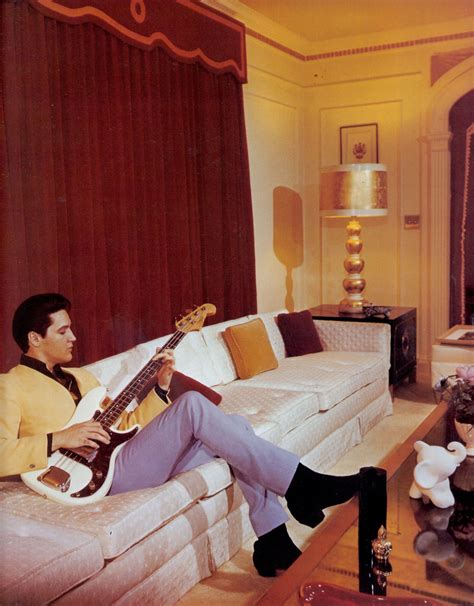 ELVIS PRESLEY at GRACELAND in the living room during its first red