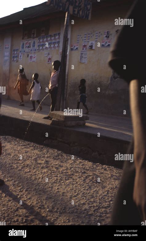 boy pissing   street  ghana west africa stock photo alamy