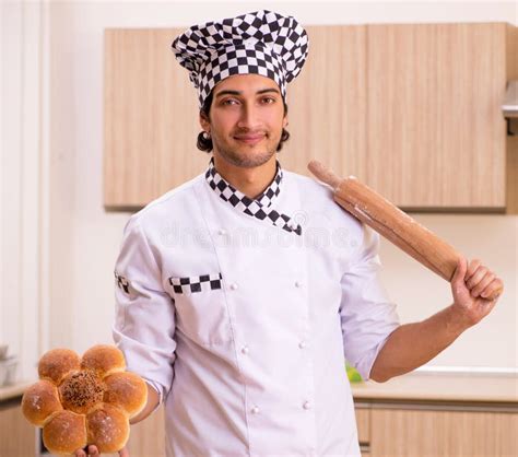 Young Male Baker Working in Kitchen Stock Photo - Image of dough ...