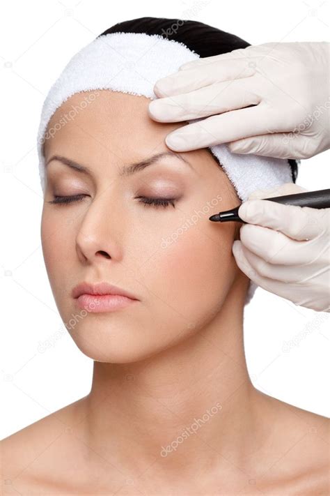 Marking imperfect parts of face marked with black pencil Stock Photo by ...