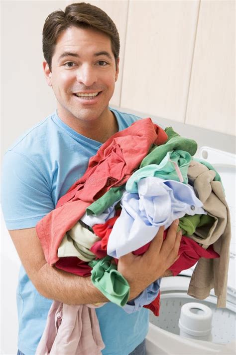 Man Doing Laundry stock image. Image of holding, hispanic - 6881763