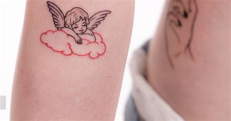 Cherub tattoo located on the forearm.