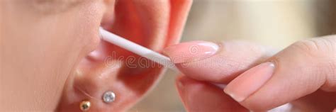 close   women cleans  ear  cotton swab stock image image