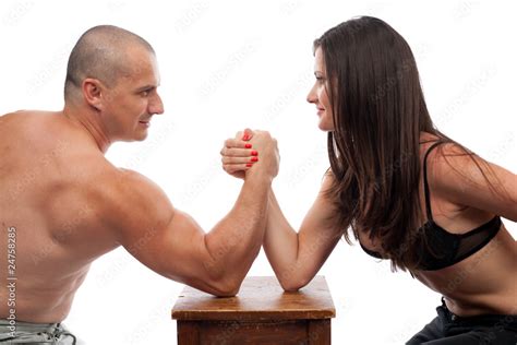 Man and woman arm wrestling Stock Photo | Adobe Stock