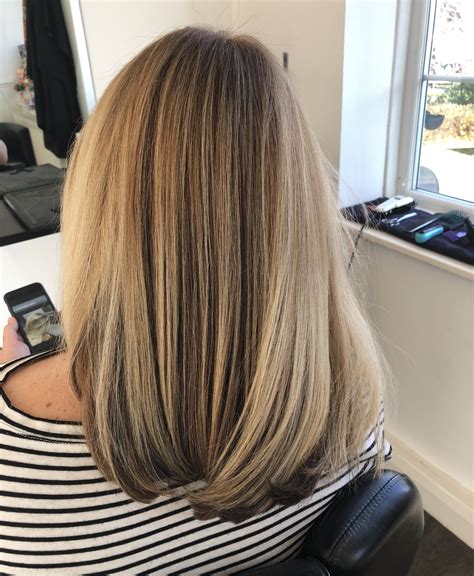 I achieved this soft blow dry by watching the stylists in my salon. I