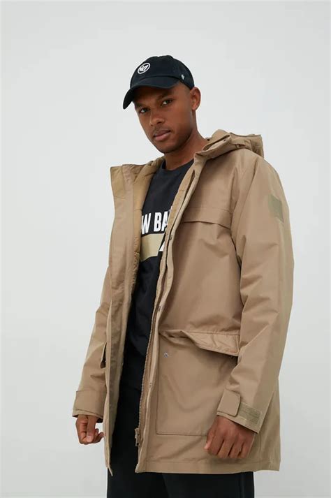 Jack Wolfskin kurtka męska kolor beżowy zimowa | Answear.com