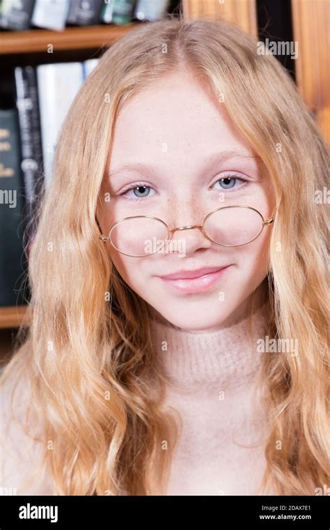 Cute 12-year-old girl wearing old-fashioned spectacles Stock Photo - Alamy