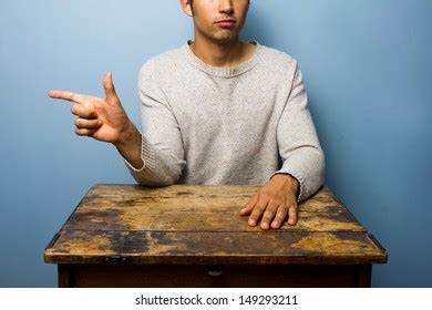 young man pointing left stock photo  shutterstock