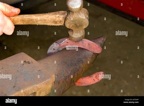Red hot horse shoe on anvil Stock Photo - Alamy