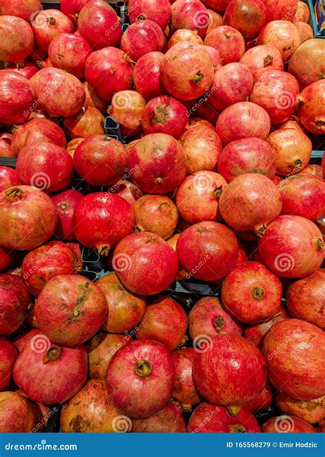 Delicious And Good Looking Red Pomegranate Stacked In The Store For