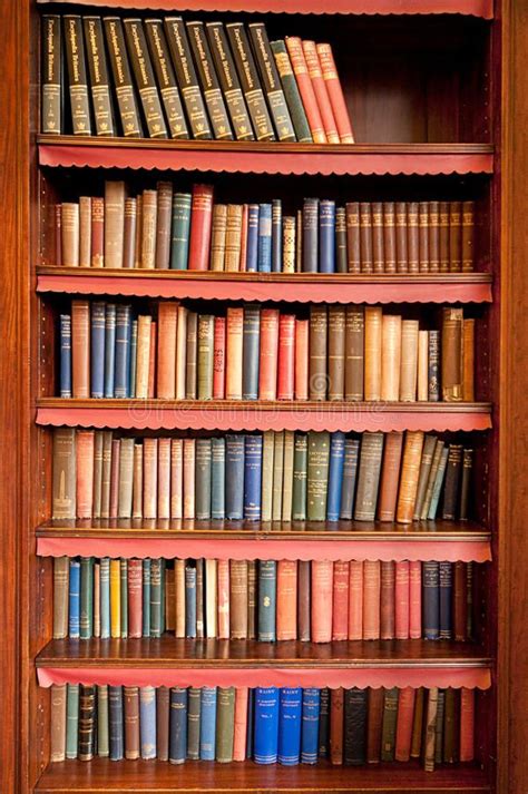 Old bookshelf in ancient library. Bookshelf with a lot of old books in ...