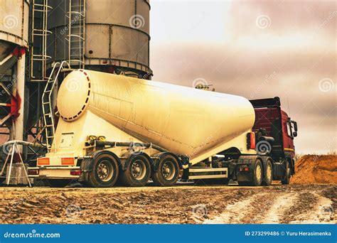Large Truck for Transporting Cement. a Cement Truck Unloads Cement at a ...