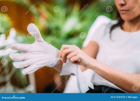 Using Moisturising Cosmetic Gloves To Moisturize Skin of the Hands at ...