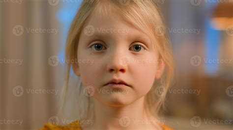 Portrait little girl pensive upset serious Caucasian child kid offended