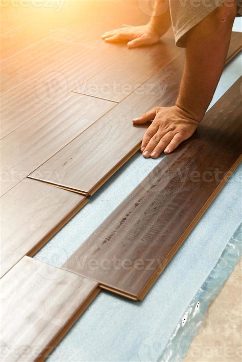 Man Installing New Laminate Wood Flooring 16356468 Stock Photo at Vecteezy