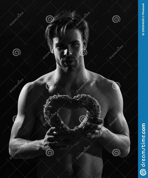 Muscular Macho Man with Naked Chest Hold Valentines Day Heart Present